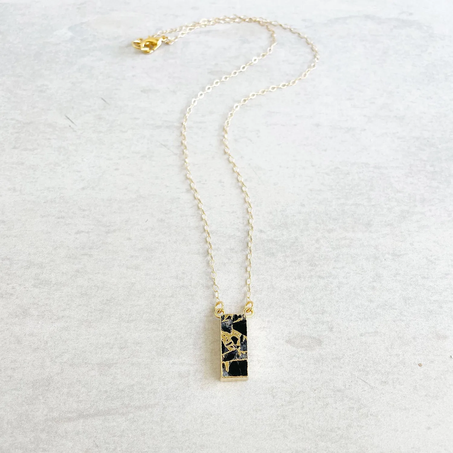 Black Mojave Bar Necklace in Gold. Simple Gold Layering Necklace