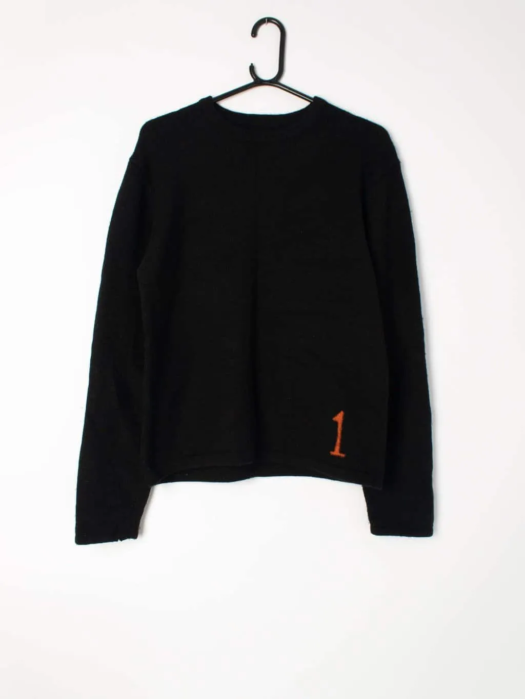 Merino wool plain black jumper with neon orange number ‘1’ detail – Medium